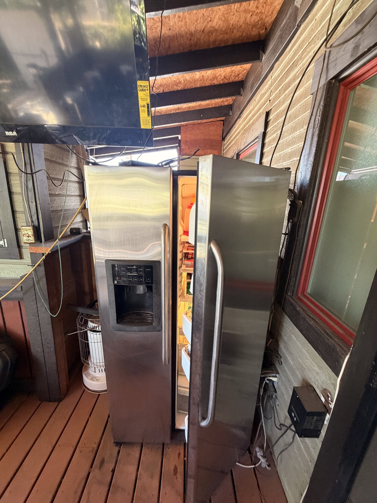 Exposed evaporator coils during a refrigerator repair by an Era Service technician in the Inland Empire