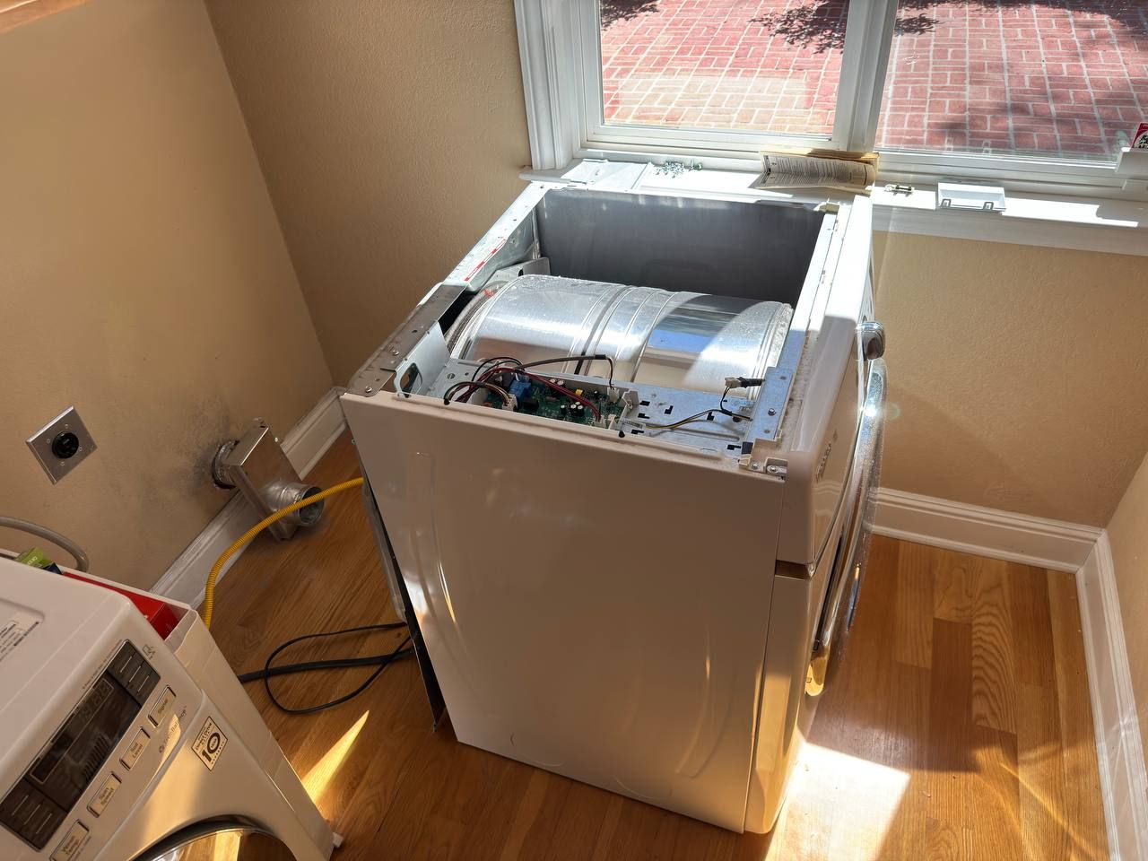 Top-load washer opened for repair by Era Service in Chino